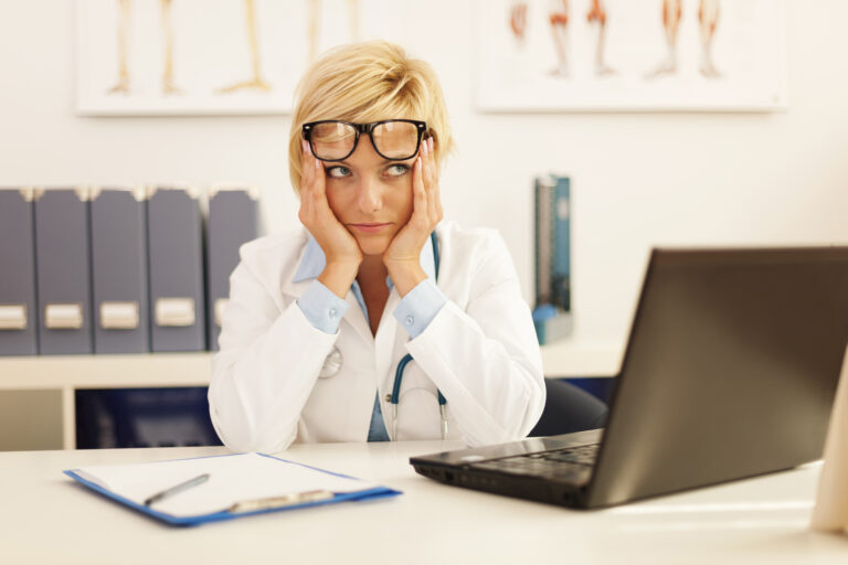 desperate-female-doctor-sitting-her-office-scaled-gap-cover